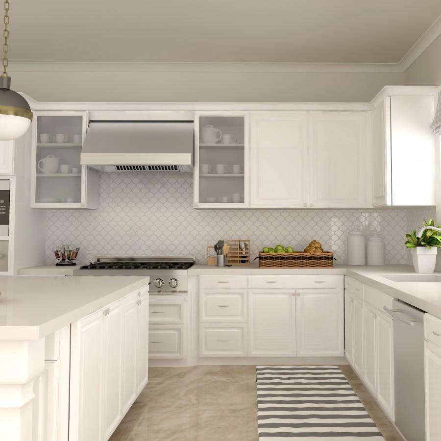 Under-cabinet range hood mounted above the cooktop in a white kitchen