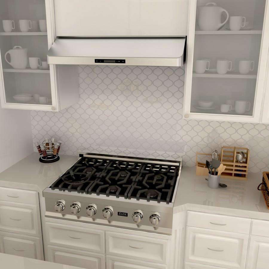 Under-cabinet range hood above a gas cooktop in a kitchen
