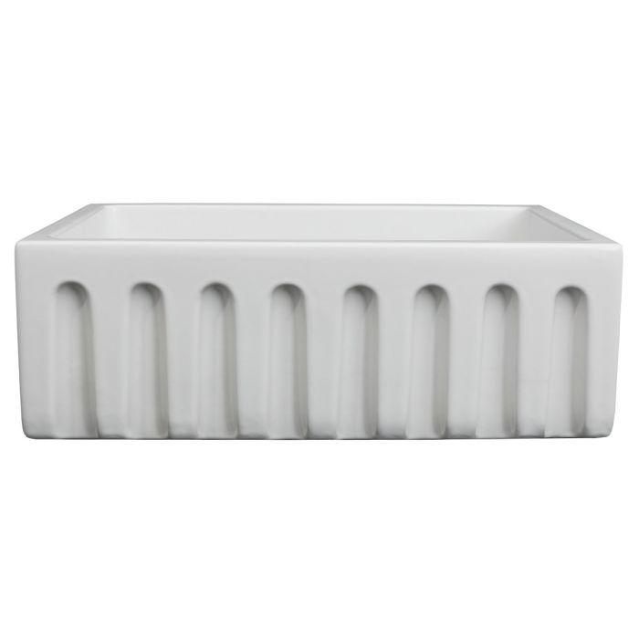 White matte apron-front single-bowl sink with raised front apron panel and cutouts
