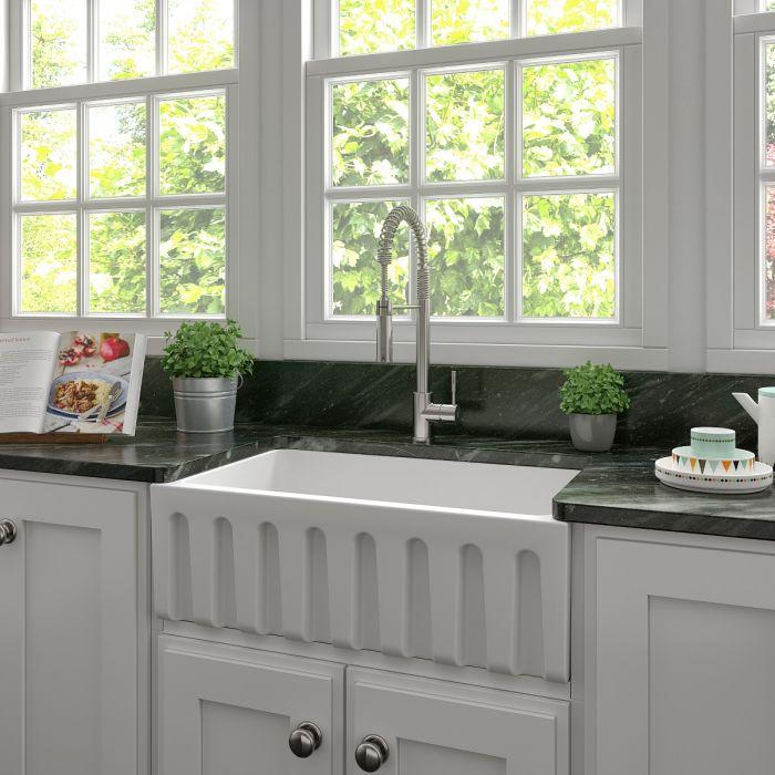 Apron-front farmhouse fireclay kitchen sink with ribbed front and white matte finish