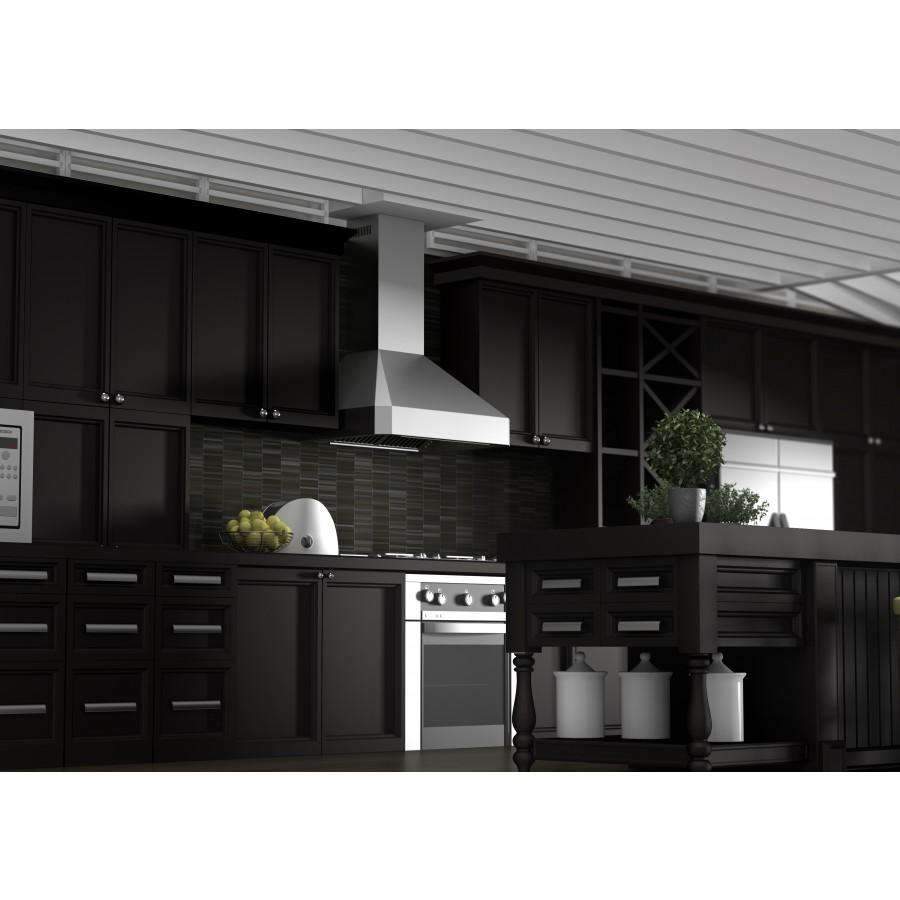 White wall range hood centered on black cabinetry with front vent opening