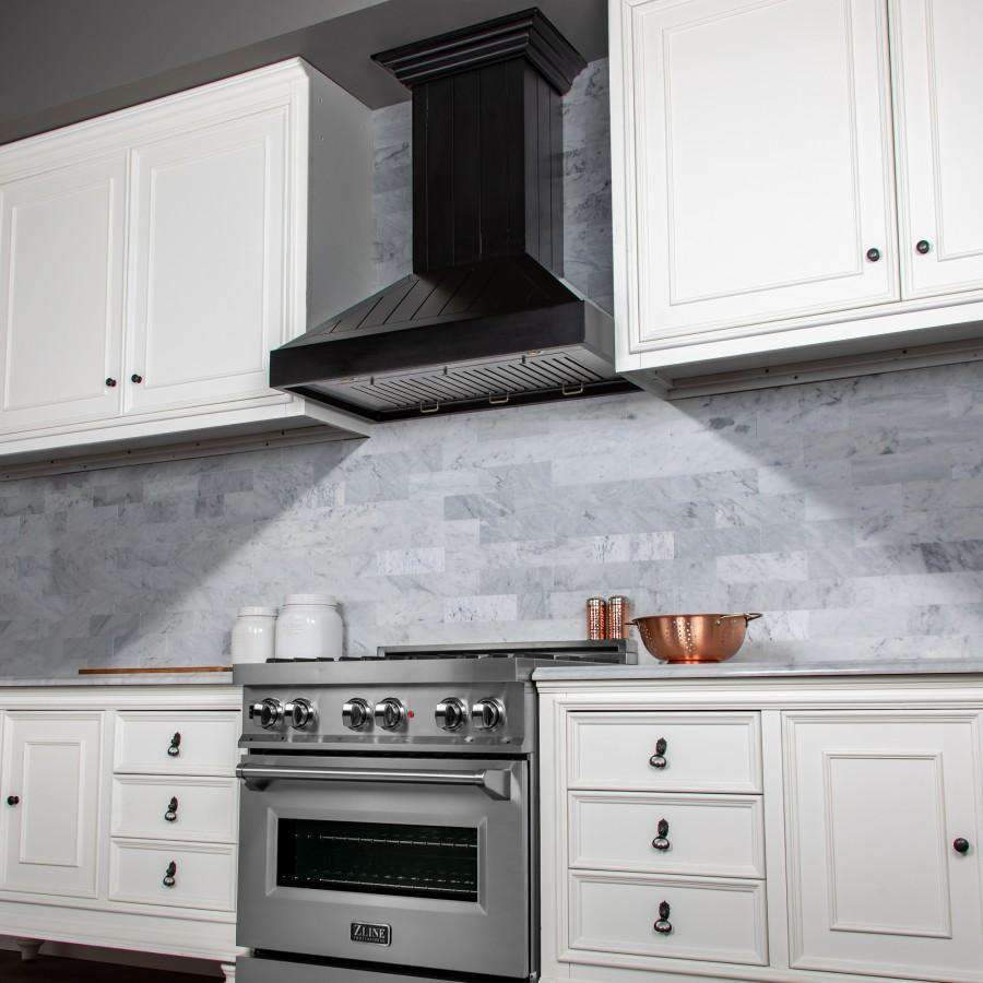 Black wooden range hood canopy with vent filters above a gas range