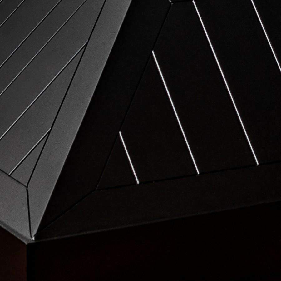 Black range hood interior with vent slats and hanging baffle-like baffle