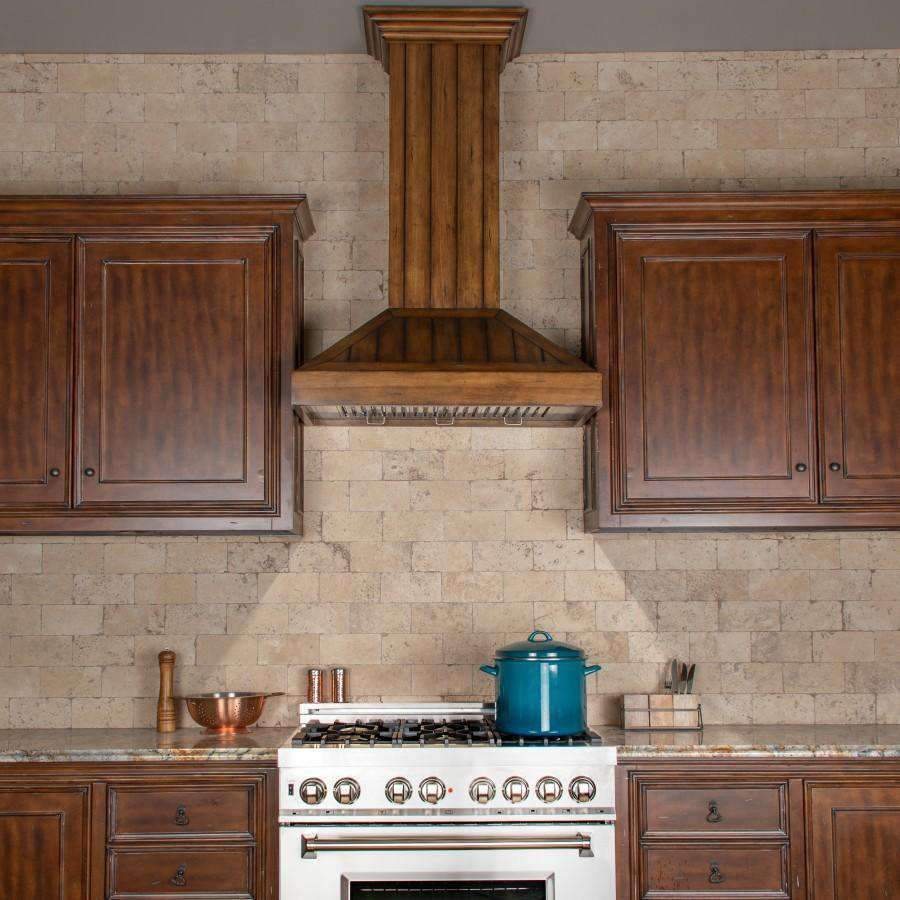 Rustic light wood wall range hood over cooktop with surrounding cabinetry