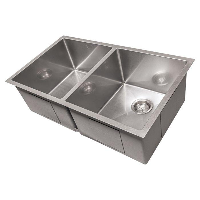Stainless steel double-bowl undermount kitchen sink, shown at an angled view with round drain