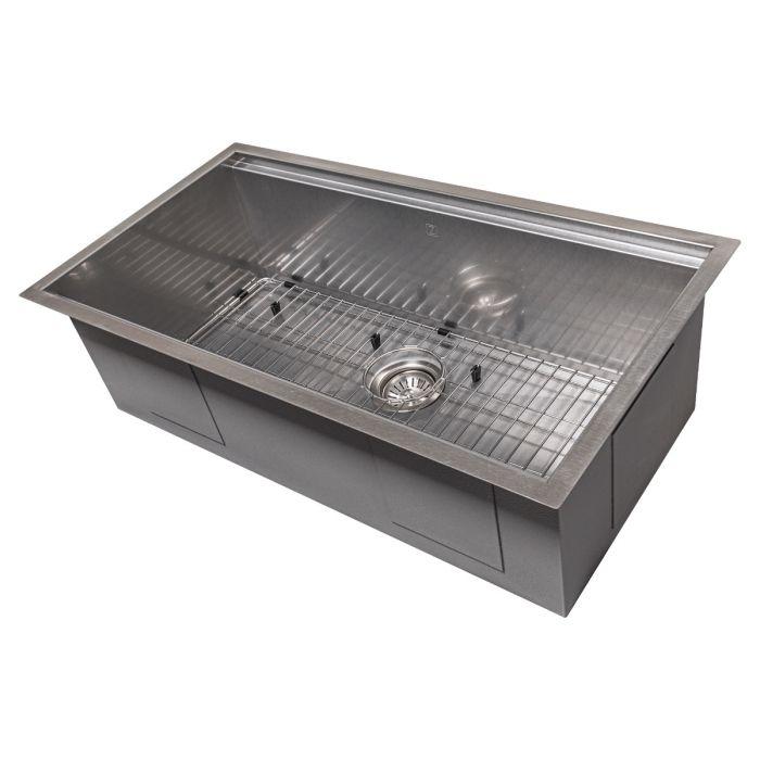 Single-bowl stainless steel kitchen sink with bottom grid and round strainer
