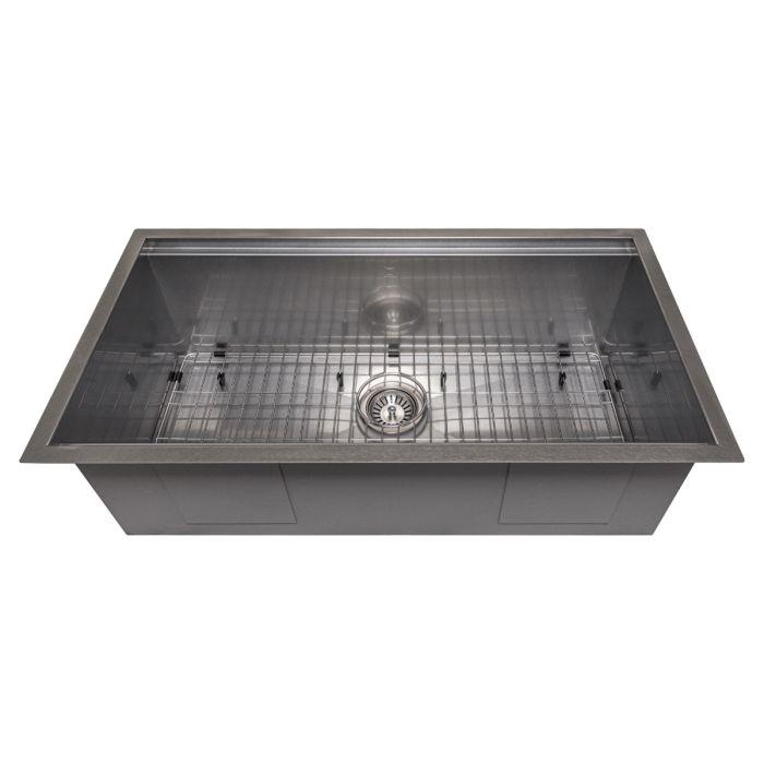 Single-bowl stainless steel sink showing bottom grid and drain fixture