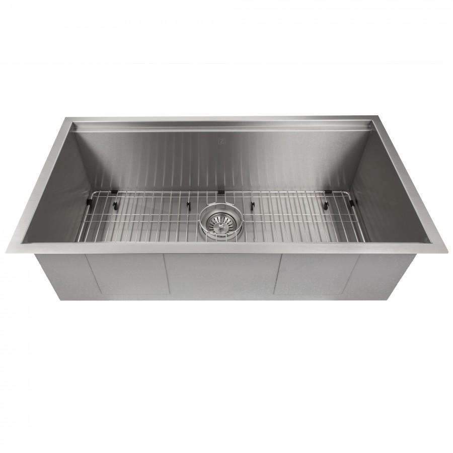Single-basin stainless steel sink with bottom grid and circular drain strainer.
