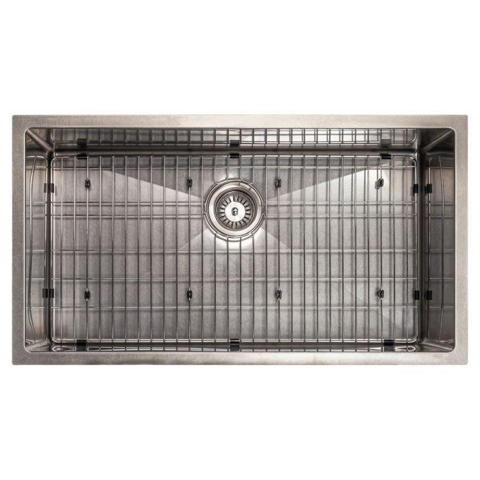 Single-bowl stainless steel kitchen sink with bottom rack grid and central drain strainer