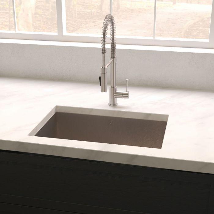 Undermount stainless steel single-bowl sink with central drain strainer and kitchen faucet