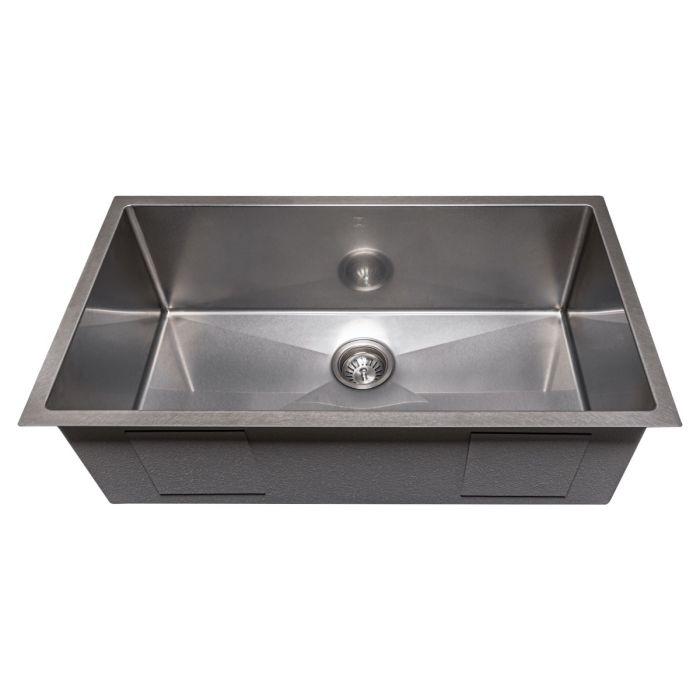 Stainless steel single-bowl kitchen sink with central drain strainer and sloped basin
