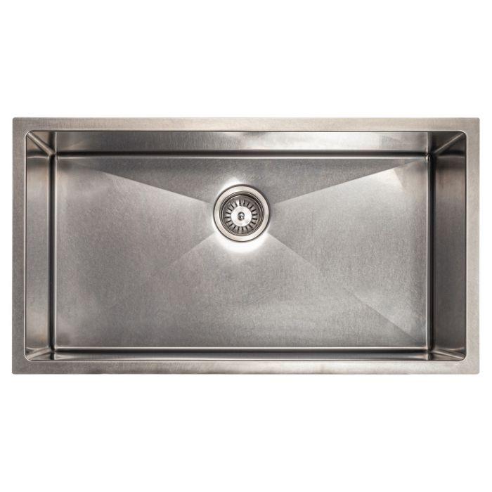Stainless steel single-bowl kitchen sink with central drain strainer and clean basin
