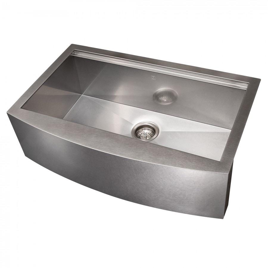 Single-bowl stainless steel sink with center drain strainer, angled view