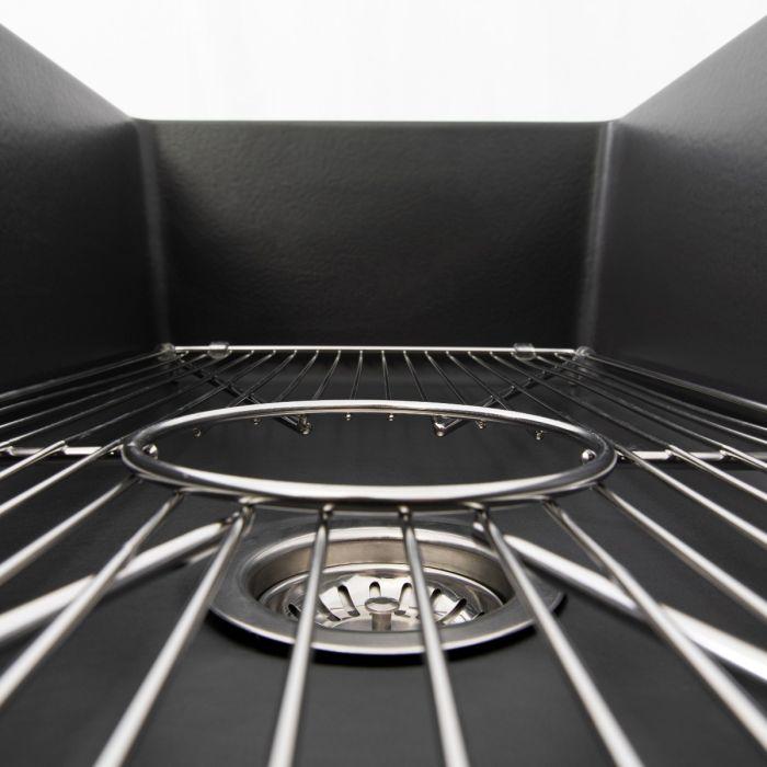 Stainless bottom grid detail with curved supports and center drain opening