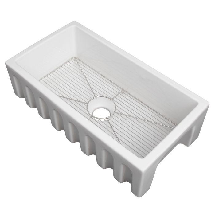 White single-bowl kitchen sink with bottom grid and central drain strainer