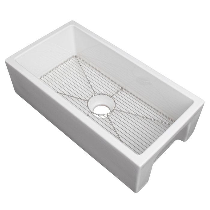 White single-bowl sink with bottom grid and round drain opening