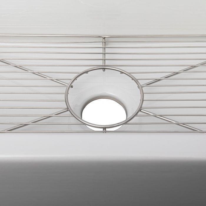 White single-bowl sink with bottom grid and circular strainer opening