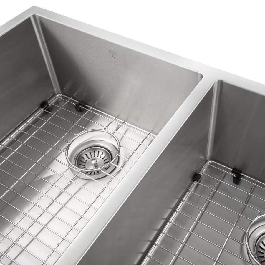 Close-up of stainless double-bowl sink with wire grid and round drain strainer