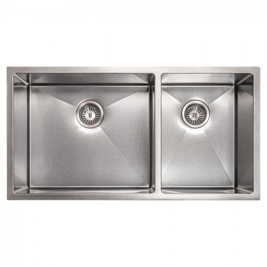 Stainless steel double-bowl sink with two empty basins and drain openings