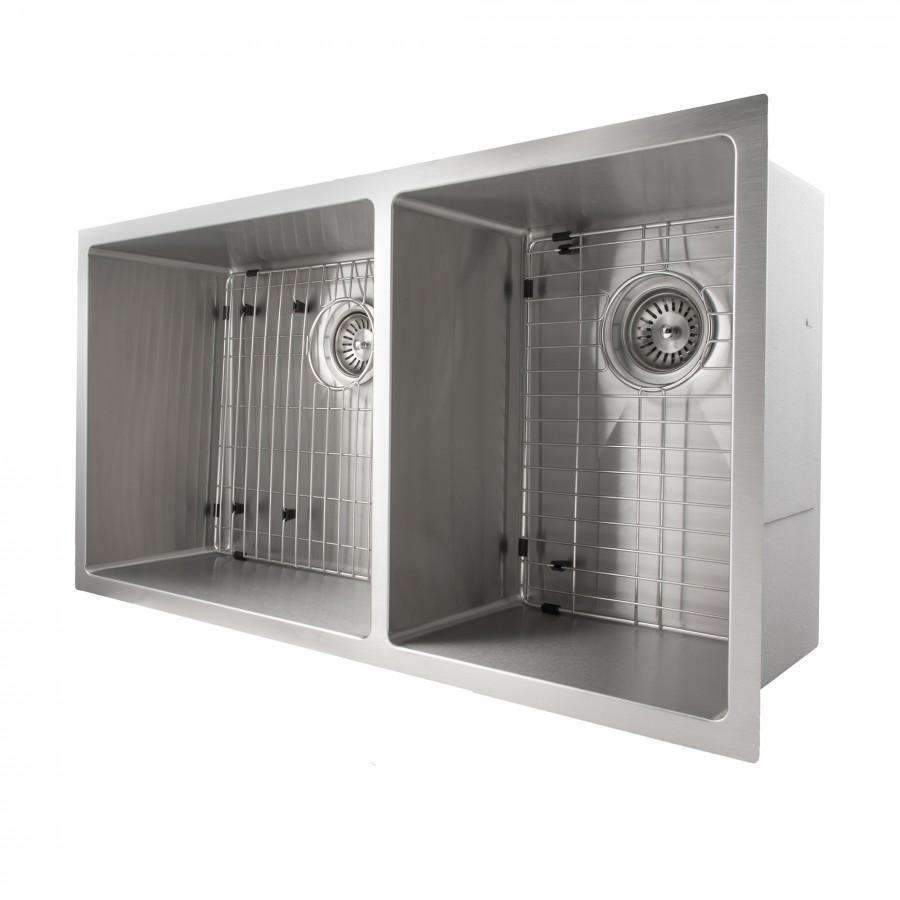 Double-bowl sink corner view with strainers and grid racks