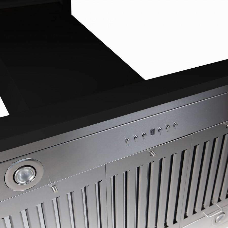 Stainless control panel and vent slots on a black chimney island range hood.