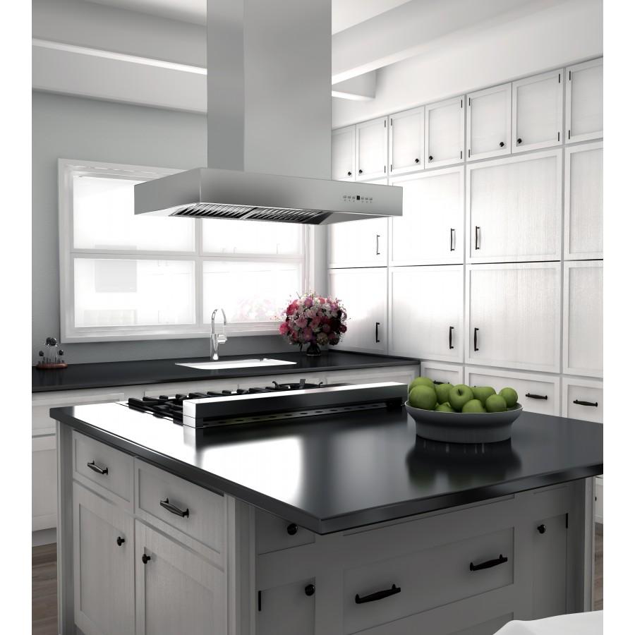 Island mount stainless steel range hood above black cooktop with white cabinetry