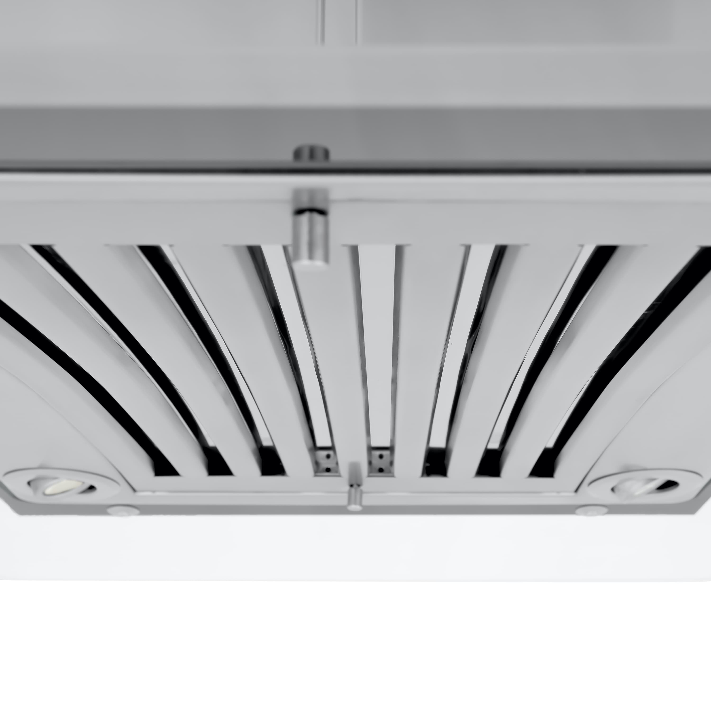 Close-up of internal fan grille and lighting under an island range hood