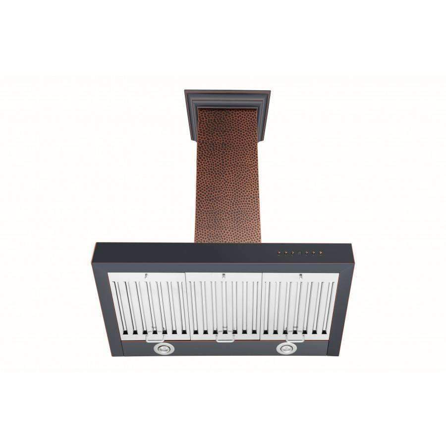Wall-mounted range hood with copper chimney and black underside baffle filters