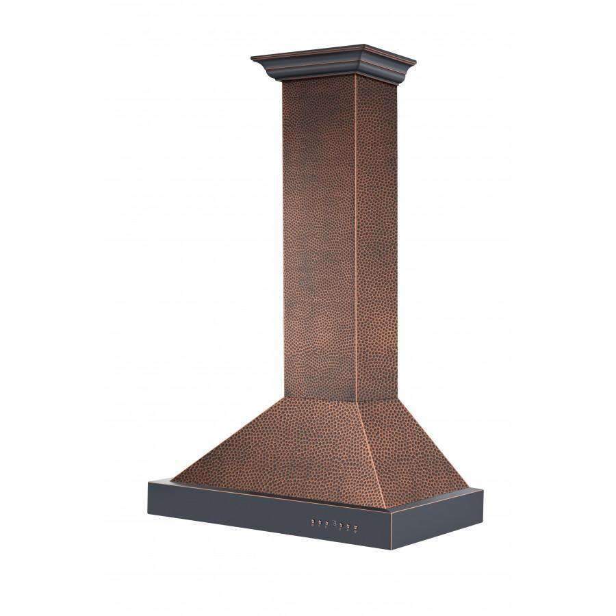Wall-mount copper range hood with hammered finish and wide chimney canopy