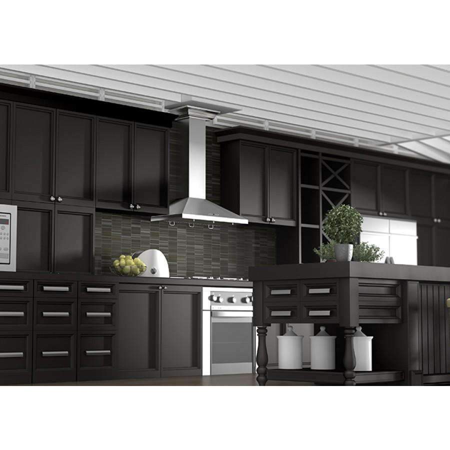 Stainless steel wall range hood above stove with chimney canopy