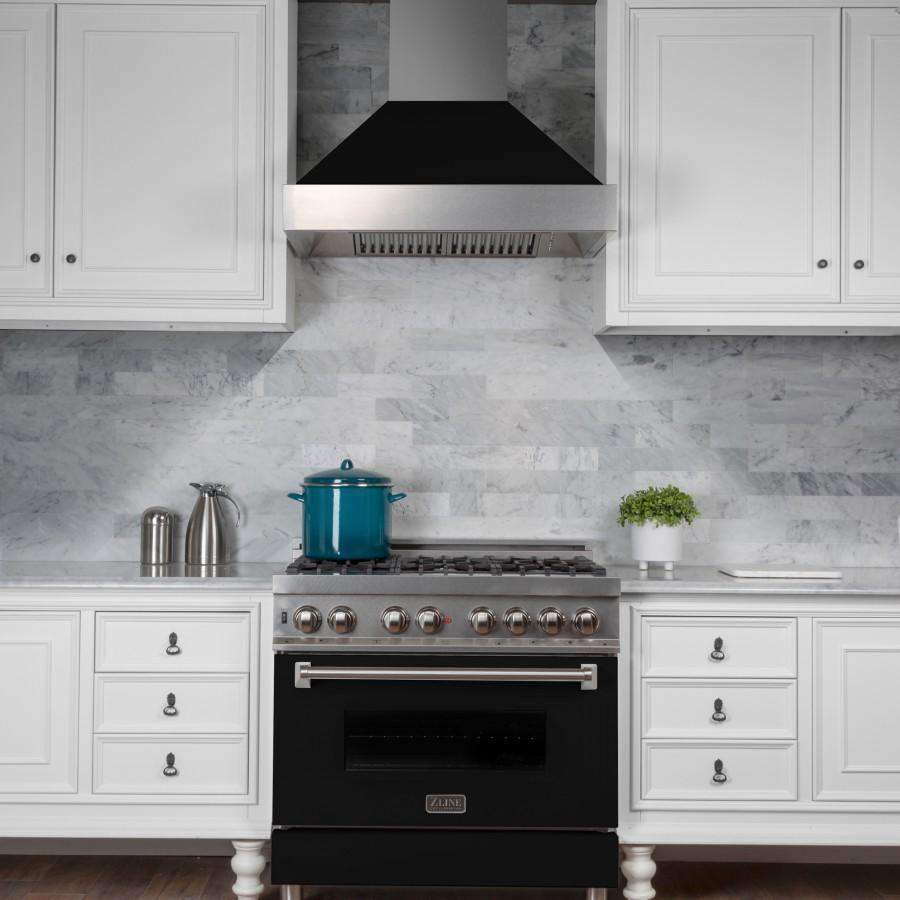 Wall-mounted ducted range hood with black matte chimney interior and satin stainless finish