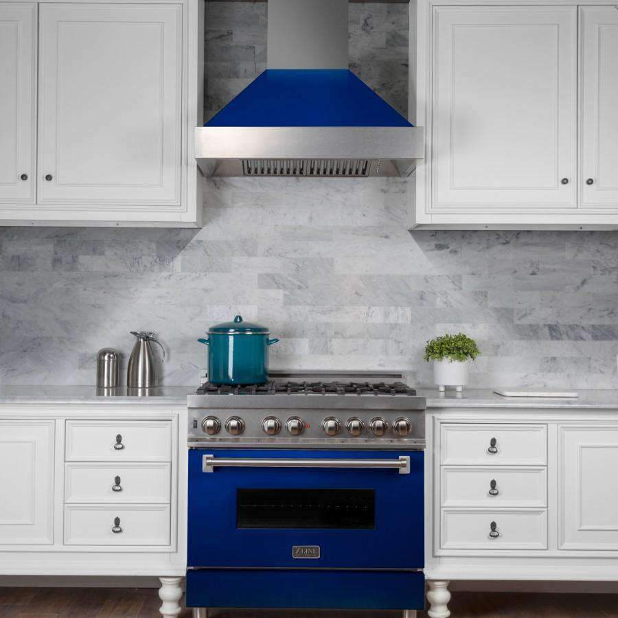 Wall-mounted ducted range hood with blue canopy and stainless chimney above a stove
