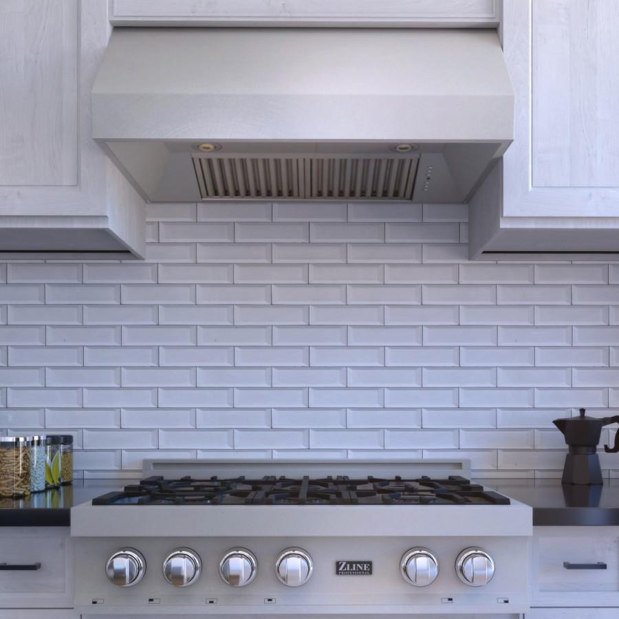 Stainless steel under-cabinet range hood with vent grille and warm light fixtures