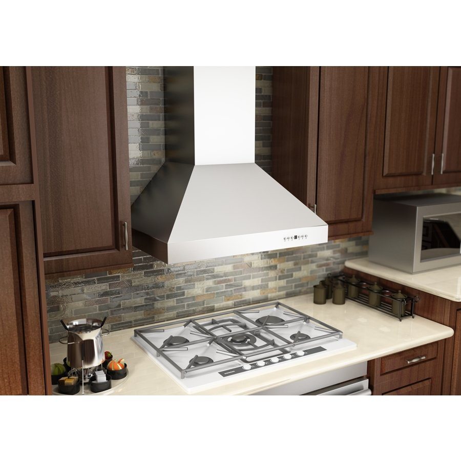 Stainless steel ducted wall mount range hood installed above a gas cooktop