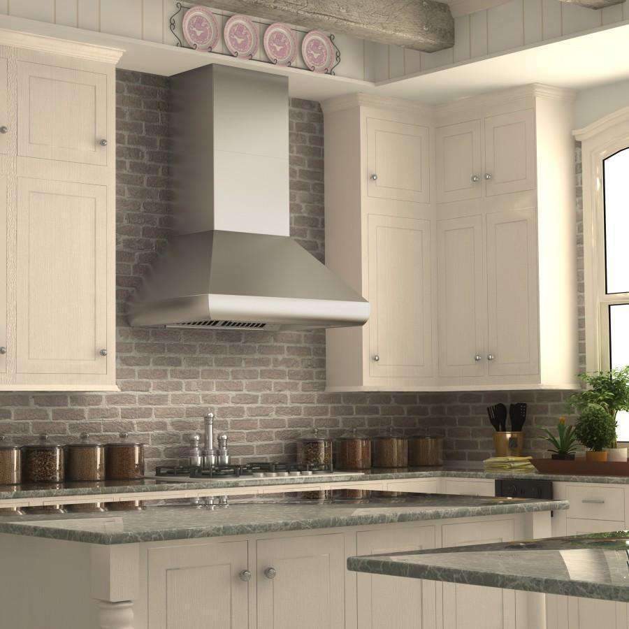Stainless steel ducted wall mount range hood installed over a kitchen stove.