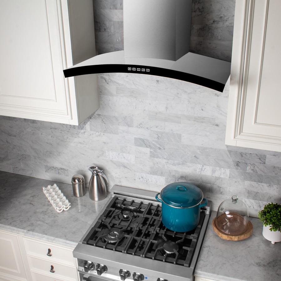 Stainless wall hood with curved black baffle and vented underside