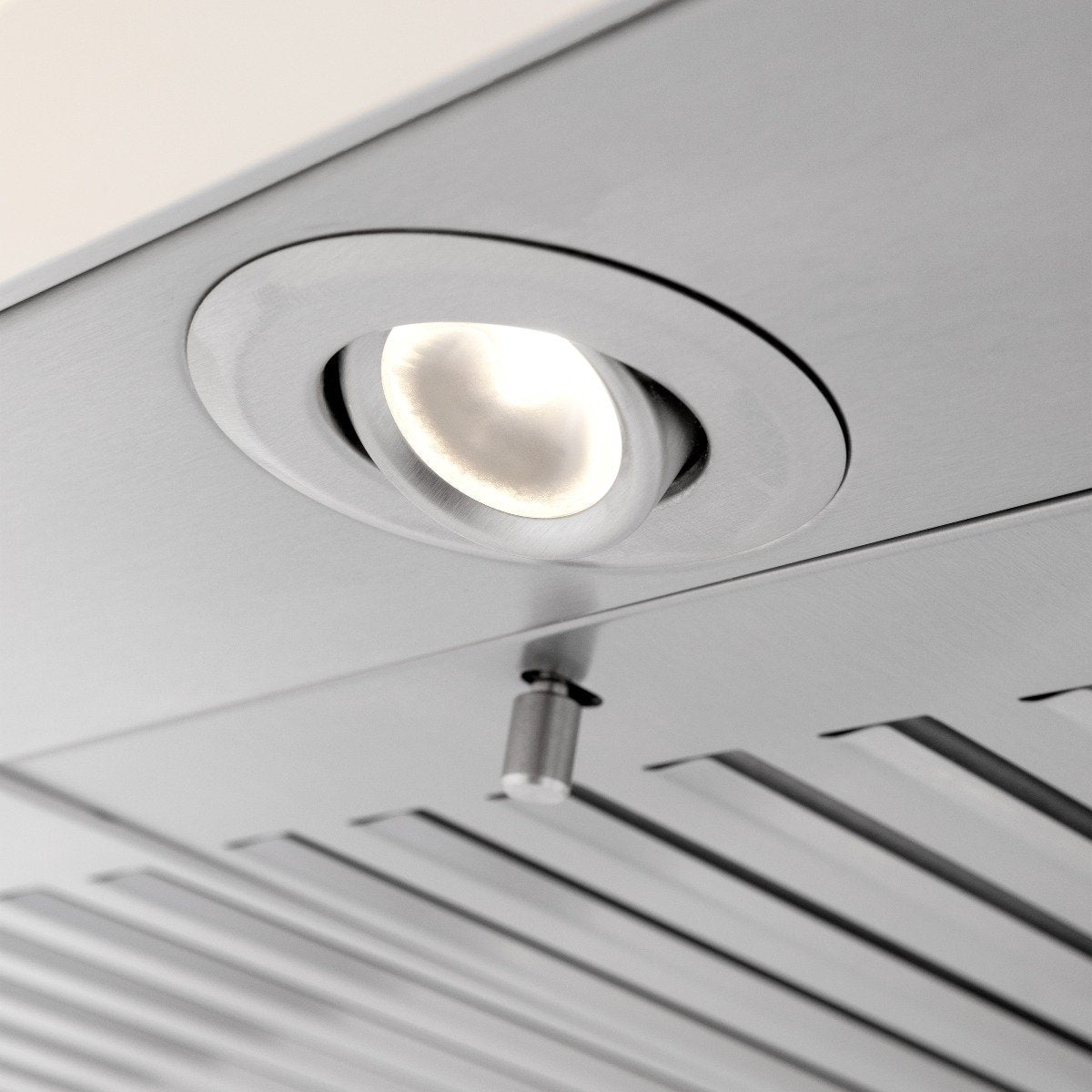 Cottage white range hood underside with recessed light and vent baffle