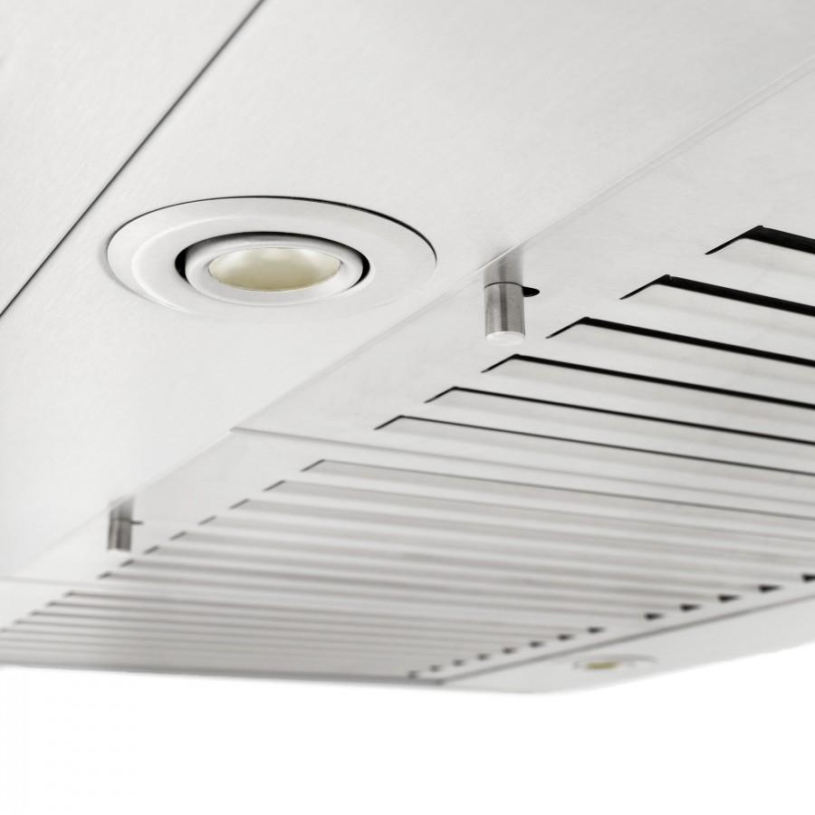 Island range hood underside with circular light and vent grilles