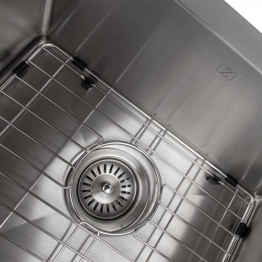Close-up of stainless steel double-bowl sink drain with wire bottom grid