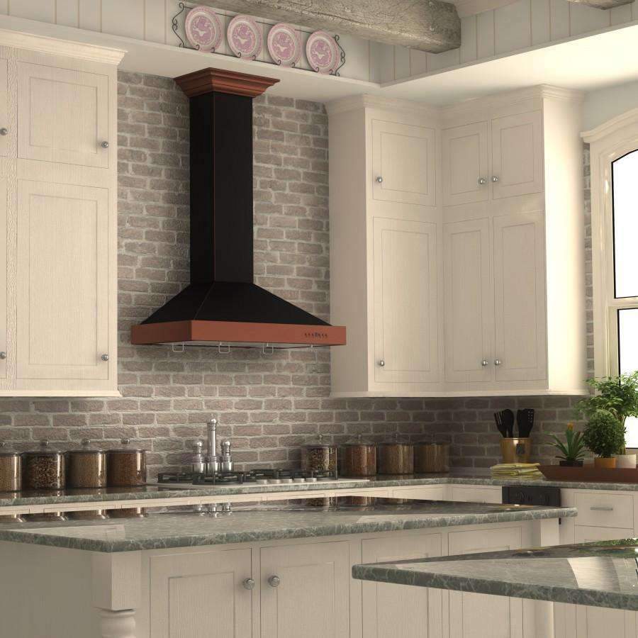 Black chimney and oil-rubbed bronze wall range hood above a gas cooktop in a kitchen.