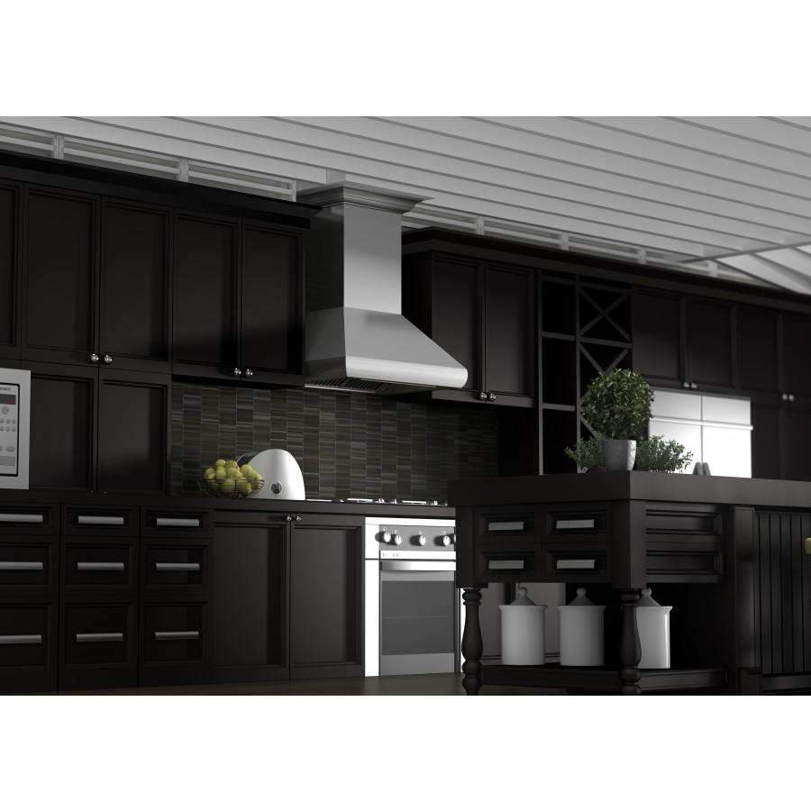 Stainless steel range hood centered over stove, chimney-style with vented canopy