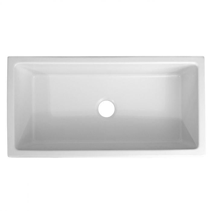 White single-bowl fireclay sink with centered drain hole