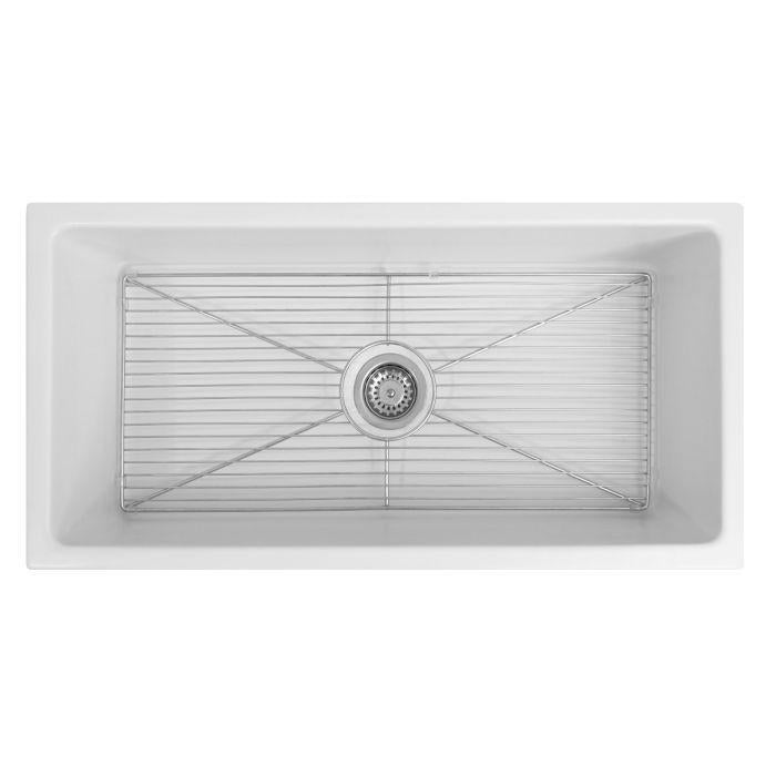 White rectangular fireclay sink basin with built-in drain opening and sloped bottom
