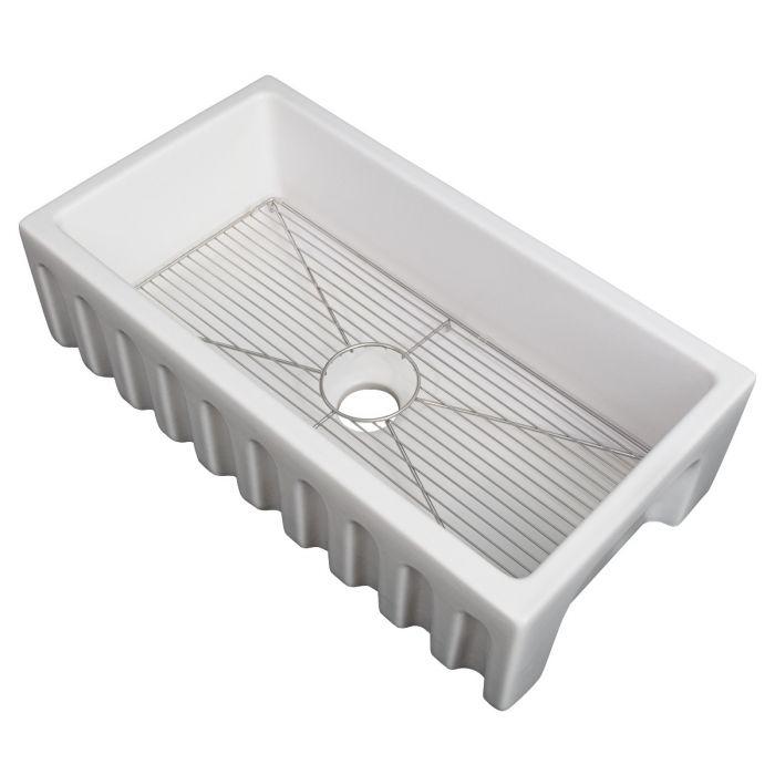 White matte fireclay single-bowl sink with bottom grid and circular drain opening