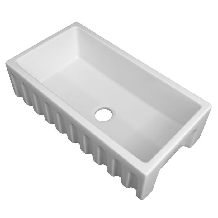 White matte fireclay single-bowl sink with centered drain hole