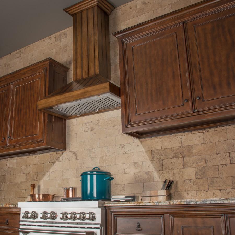 Rustic wooden wall range hood underside with vent grilles beneath the canopy