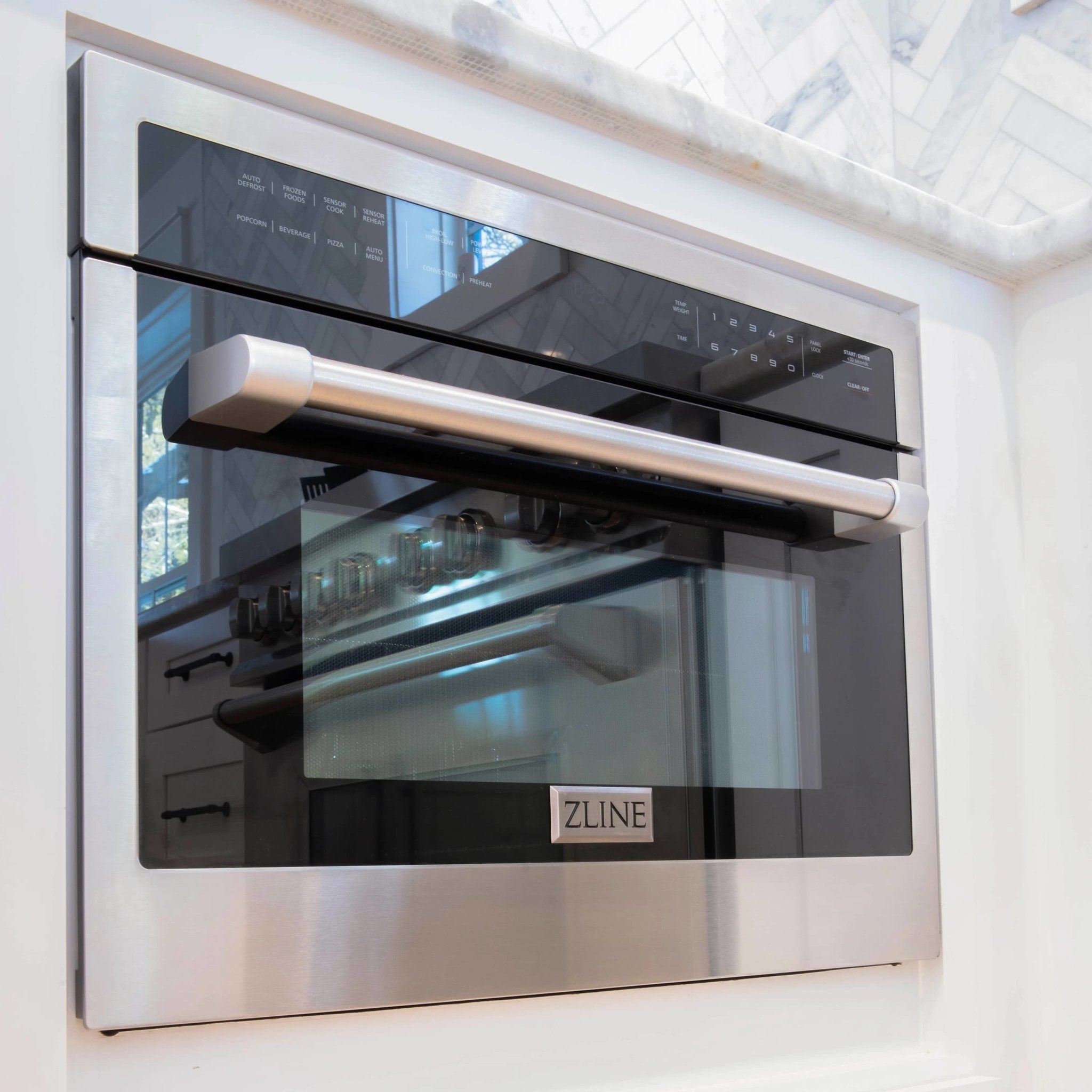 Built-in dual fuel range oven door with ZLINE badge and black control panel