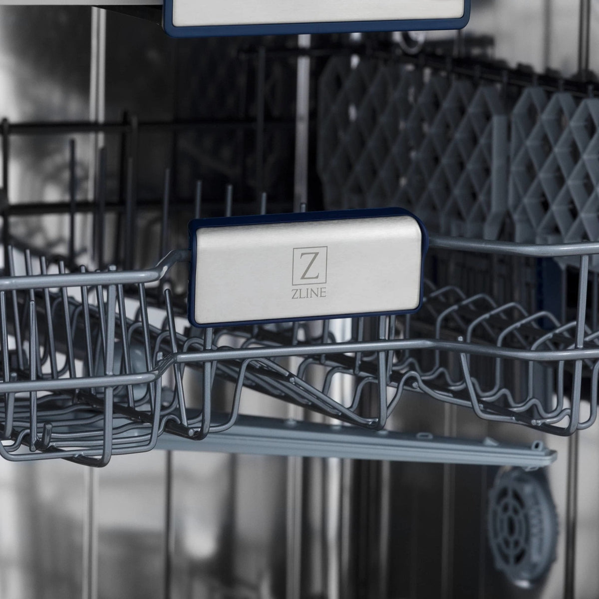 Dishwasher rack close-up with blue label and silver wire tines