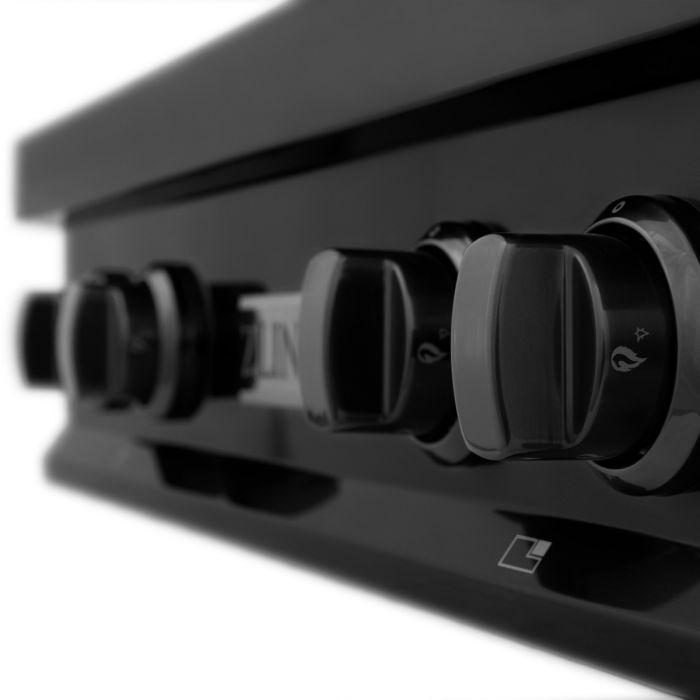 Range hood front controls with three knobs and small indicator icons