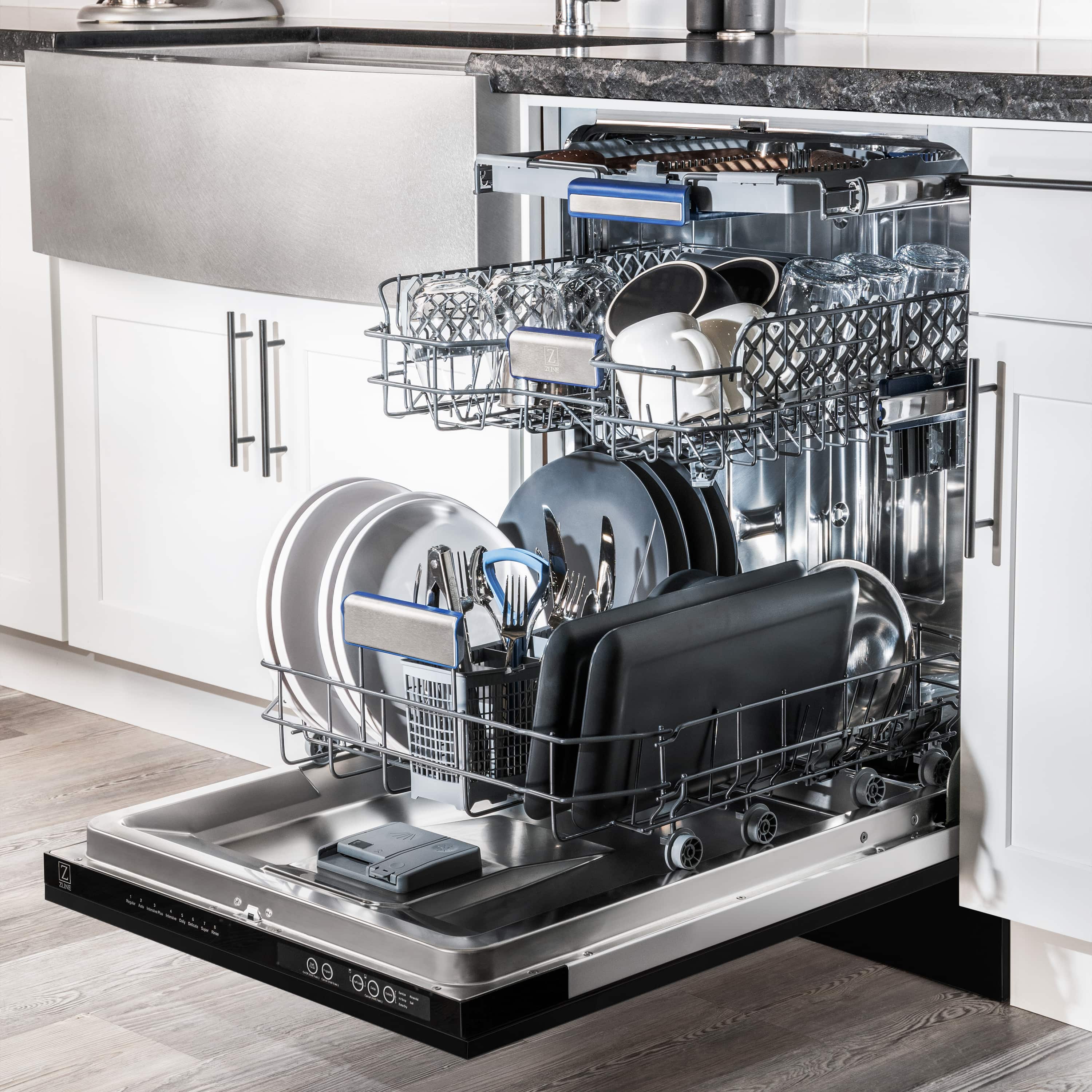 Built-in dishwasher with loaded racks of plates and cookware